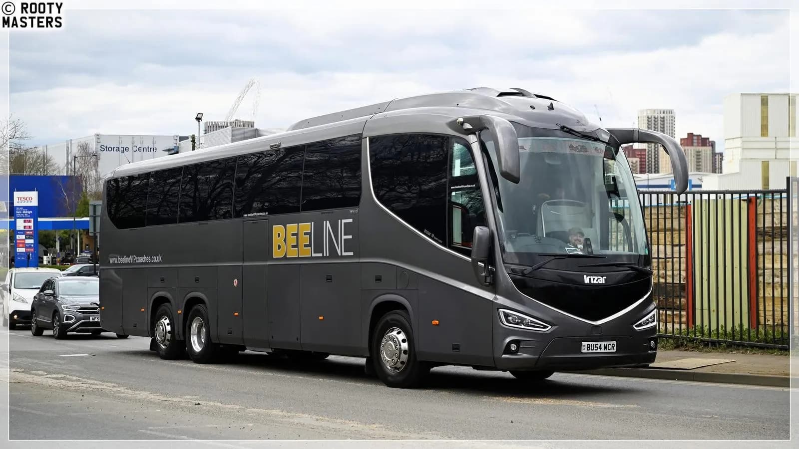 Beeline VIP driver beside the coach